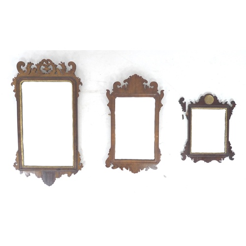 268 - A group of three Georgian silhouette framed mirrors, the largest with walnut frame and gilt mount, t... 