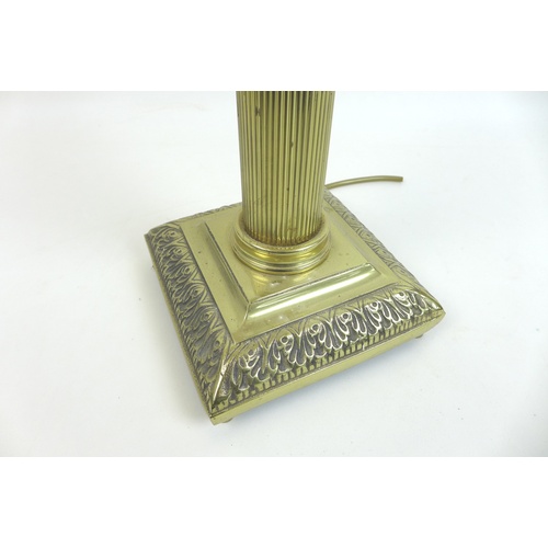 85 - An early 20th century brass table lamp in the form of a Corinthian column, with square form base, 17... 