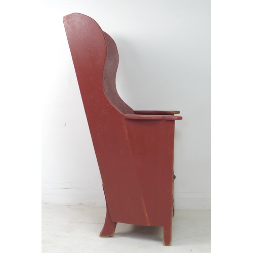 269 - A modern pine lambing chair, in 18th century style, red painted with distressed finish, cupboard to ... 