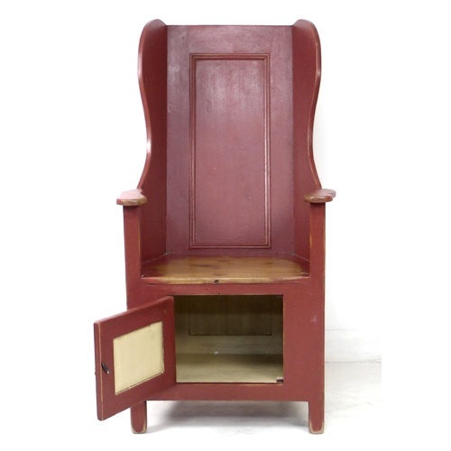 269 - A modern pine lambing chair, in 18th century style, red painted with distressed finish, cupboard to ... 