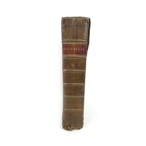 133 - An early 19th century family Bible, leather bound, with commentary from 'Poole, Henry, Doddridge, Br... 