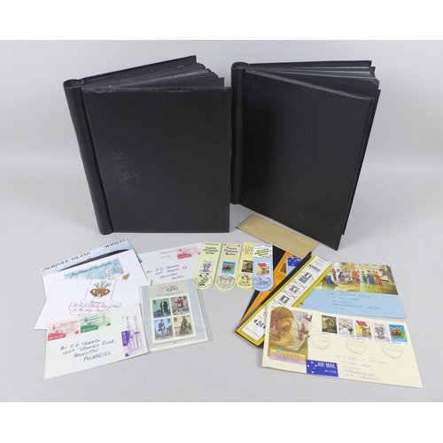 141 - Two black albums containing a variety of mint unmounted British QEII stamps, each in outer boxes, to... 