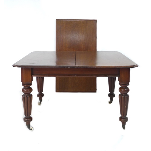 319 - A mahogany dining table square top, with fluted legs and castors, 124 by 120 by 30cm high, single ad... 