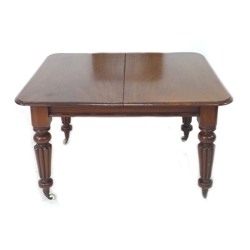 319 - A mahogany dining table square top, with fluted legs and castors, 124 by 120 by 30cm high, single ad... 