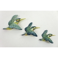 A group of three Beswick ceramic wall plaques, each modelled as a kingfisher, of graduating size, st... 