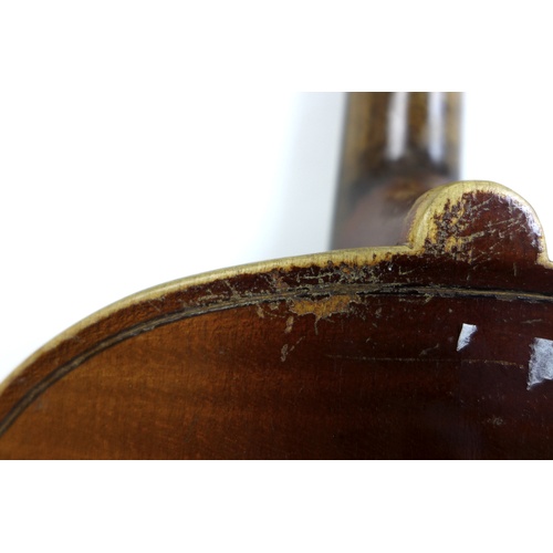 172 - An early 20th century violin, and a 19th century walnut violin coffin case, together with three viol... 