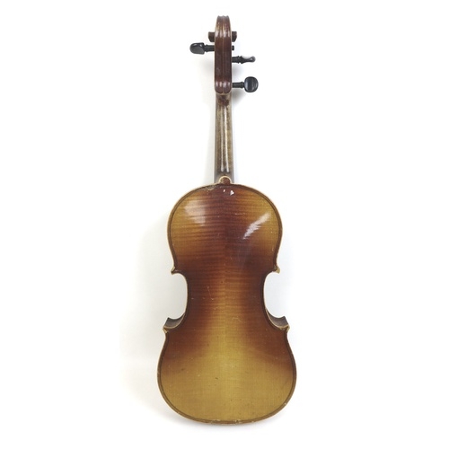 172 - An early 20th century violin, and a 19th century walnut violin coffin case, together with three viol... 