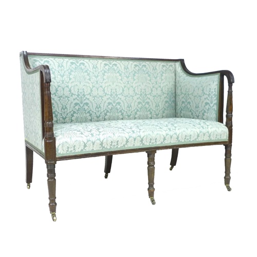 322 - A Regency mahogany framed two seater settee, with reeded decoration, raised on six turned legs with ... 