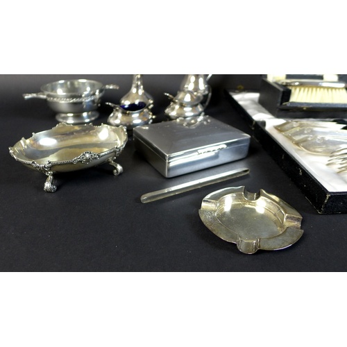 25 - A group of silver and silver plated items, comprising a pair of silver weighted dwarf candlesticks, ... 