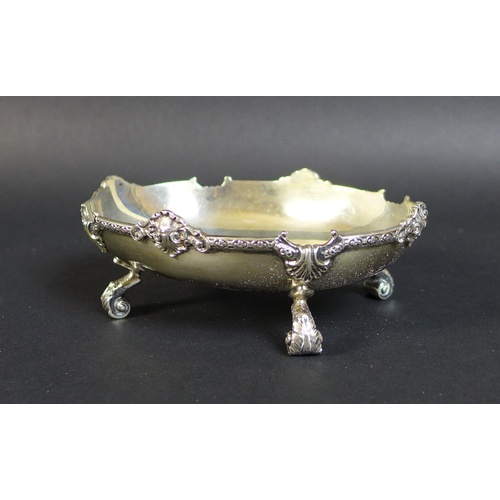 25 - A group of silver and silver plated items, comprising a pair of silver weighted dwarf candlesticks, ... 