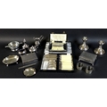 A group of silver and silver plated items, comprising a pair of silver weighted dwarf candlesticks, ... 