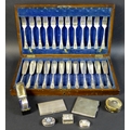A group of silver and plated items including a silver trinket box, cigarette case, napkin ring and t... 