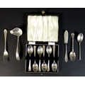 A small group of Edwardian and later silver items, comprising a cased set of silver teaspoons, Coope... 