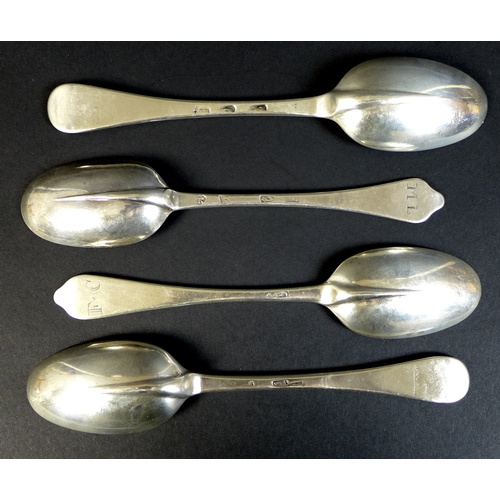 55 - A collection of four early 18th century silver tablespoons, comprising a Queen Anne dog nose spoon, ... 