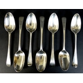 A collection of seven George III silver tablespoons, comprising two with transitional rat tail backs... 