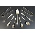 A group of Georgian and later silver pieces of flatware, comprising a George II silver three tined f... 