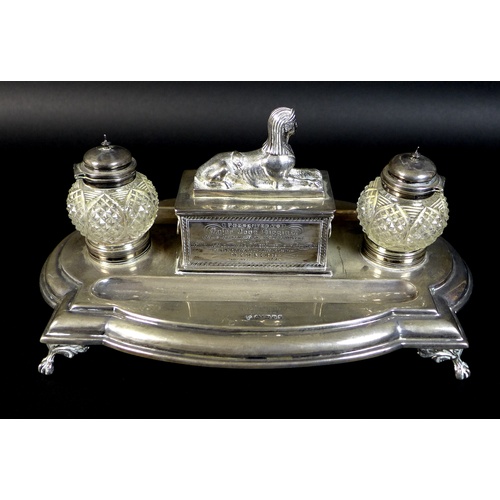 54 - A Victorian silver military presentation inkwell stand, bearing an inscription to its central sphinx... 