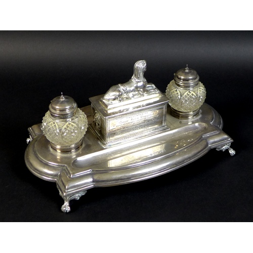 54 - A Victorian silver military presentation inkwell stand, bearing an inscription to its central sphinx... 