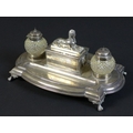 A Victorian silver military presentation inkwell stand, bearing an inscription to its central sphinx... 