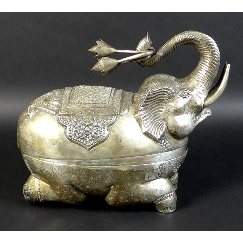 74 - A Cambodian Khmer silver zoomorphic box, in the form of an elephant holding lotus blossom, with Tola... 