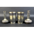 A pair of Cambodian Khmer silver beakers and two bottle vases, all finely decorated with chased and ... 