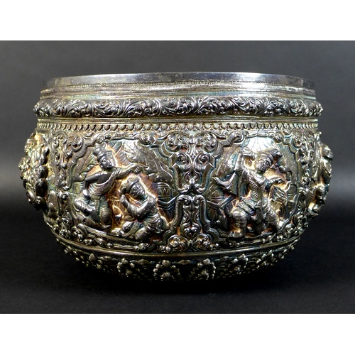 75 - An early to mid 20th century Burmese silver bowl, intricately chased and repousse work with figural ... 