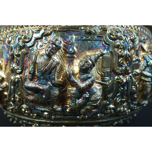 75 - An early to mid 20th century Burmese silver bowl, intricately chased and repousse work with figural ... 