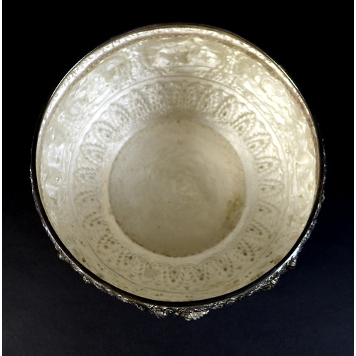 75 - An early to mid 20th century Burmese silver bowl, intricately chased and repousse work with figural ... 