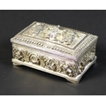 A white metal box, likely Burmese silver, mid 20th century, richly decorated with signs of the zodia... 