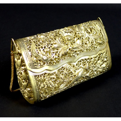 68 - An early to mid 20th century white metal purse, likely Cambodian Khmer silver, the pierced ground de... 