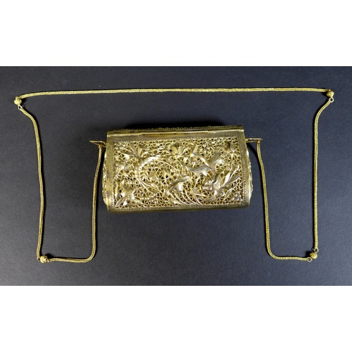 68 - An early to mid 20th century white metal purse, likely Cambodian Khmer silver, the pierced ground de... 