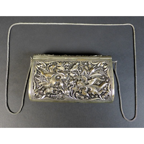 68 - An early to mid 20th century white metal purse, likely Cambodian Khmer silver, the pierced ground de... 