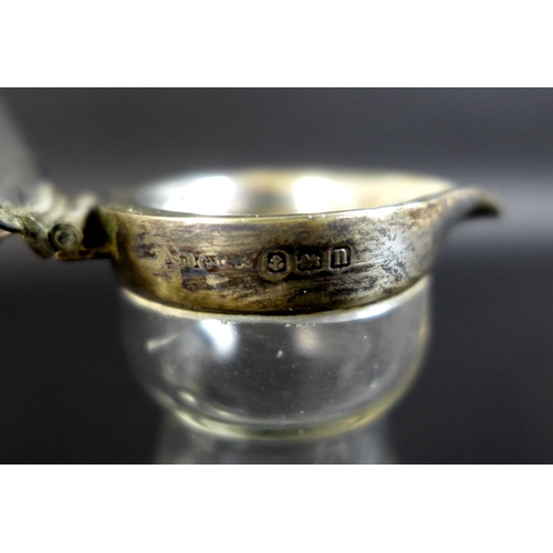 42 - A pair of Edwardian clear glass and silver mounted noggin flasks, each of tapering form with mounted... 