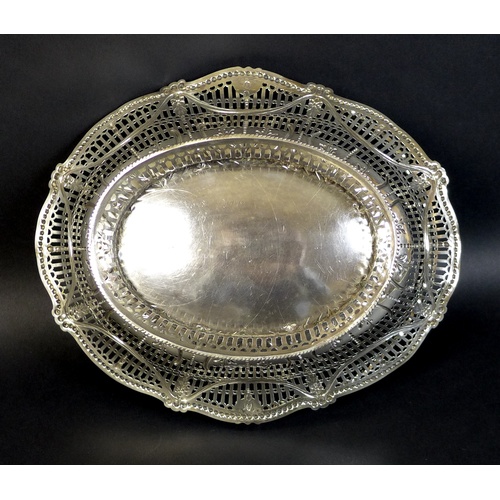 57 - A George III silver swing handled fruit basket, the pierced sides decorated with swags with harebell... 
