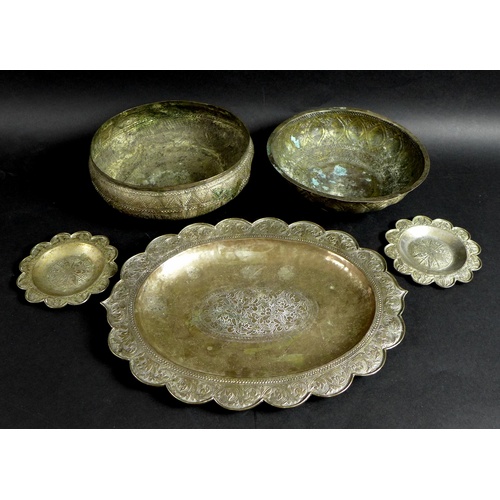 59 - A group of South East Asian white metal items, comprising an oval tray, 33.5 by 25.5cm, a pair of ci... 