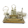A group of EPNS and glass table items, comprising an engraved glass tea mixing bowl in stand, 11 by ... 