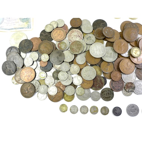 82 - A collection of British and international coins and bank notes, including some with silver content, ... 