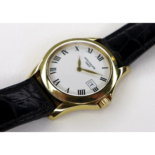 96 - A Patek Philippe Calatrava 18k gold cased lady's wristwatch, reference 4906, circa 2006, the circula... 