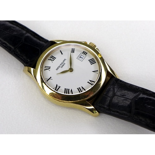 96 - A Patek Philippe Calatrava 18k gold cased lady's wristwatch, reference 4906, circa 2006, the circula... 