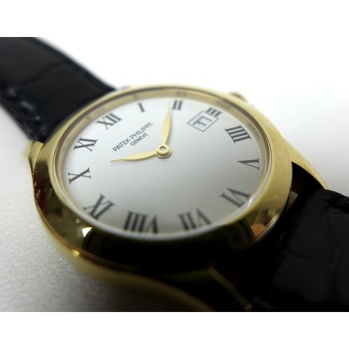 96 - A Patek Philippe Calatrava 18k gold cased lady's wristwatch, reference 4906, circa 2006, the circula... 