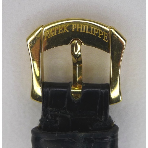 96 - A Patek Philippe Calatrava 18k gold cased lady's wristwatch, reference 4906, circa 2006, the circula... 