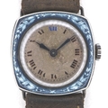 An Art Deco silver cushion cased wristwatch, with fine blue enamel decoration to the case of a ribbo... 