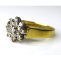 An 18ct gold and diamond flowerhead ring, formed as a chrysanthemum with a double row of diamonds su... 