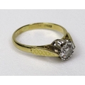 An 18ct gold diamond solitaire ring, 0.4ct approx, illusion set with decorative shoulders, marks rub... 