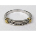 An 18ct bi coloured gold and diamond seven stone ring in rubover setting, total diamond weight appro... 
