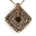 A Continental concentric diamond form pendant, set with over seventy eight round cut diamonds, most ... 