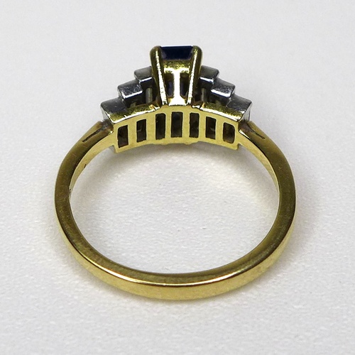 151 - An Art Deco style 18ct gold, sapphire and diamond ring, with raised platinum setting, the central bl... 