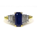 An Art Deco style 18ct gold, sapphire and diamond ring, with raised platinum setting, the central bl... 