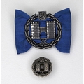 A Finnish silver heraldic pin, the symbol relating to the ancient city of Turku, set on a blue taffe... 