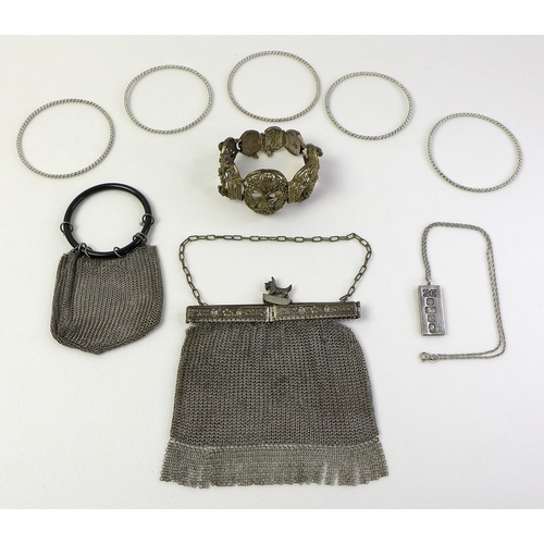 102 - A group of silver and white metal jewellery, comprising a silver ingot pendant, 3.5cm, on silver cha... 